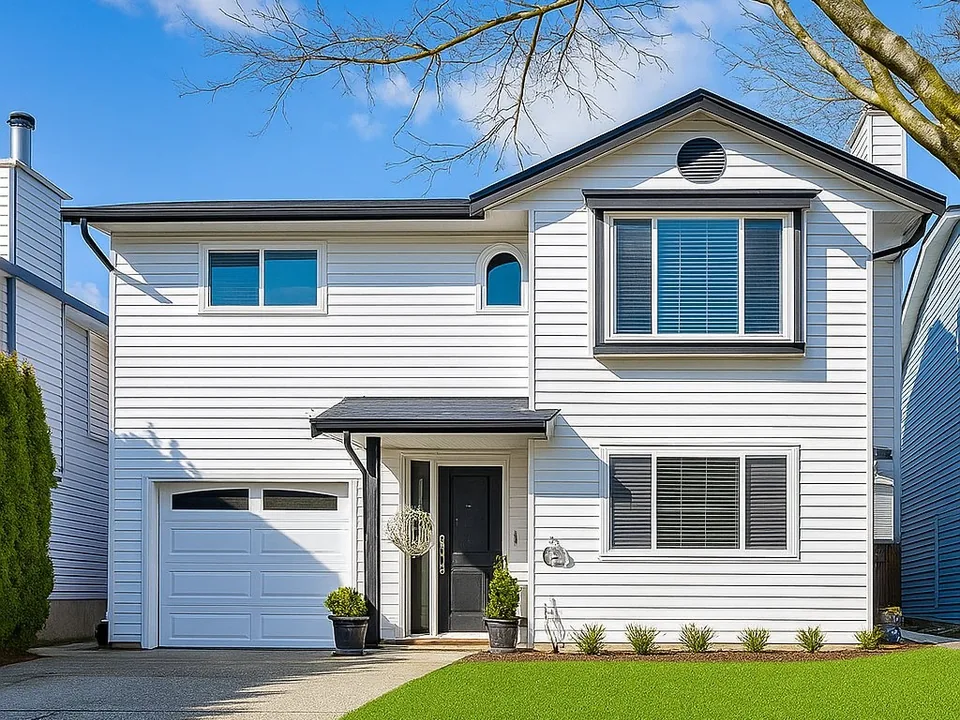 Updated front exterior of the completed Langley Meadows home renovation